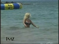 The worldwide celebrity blonde was spied on paparazzo camera showing nips that peeped out of her black bikini
